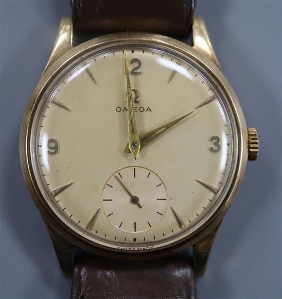 A gentlemans 1950s 9ct gold Omega manual wind wrist watch, on leather strap with Omega buckle, movement c.266,